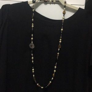 Brown, cream and silver beaded necklace